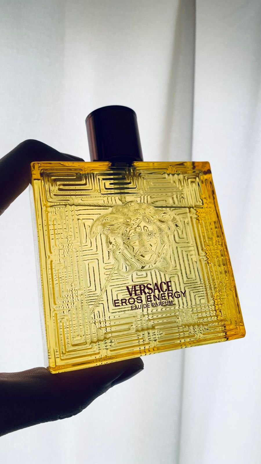 holding eros energy yellow bottle