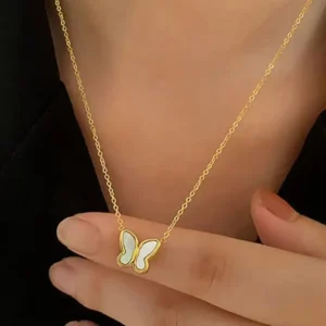 wearing butterfly shell necklace gold